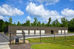 Picture of a chain link fence in front of a commercial building in Redford Michigan.