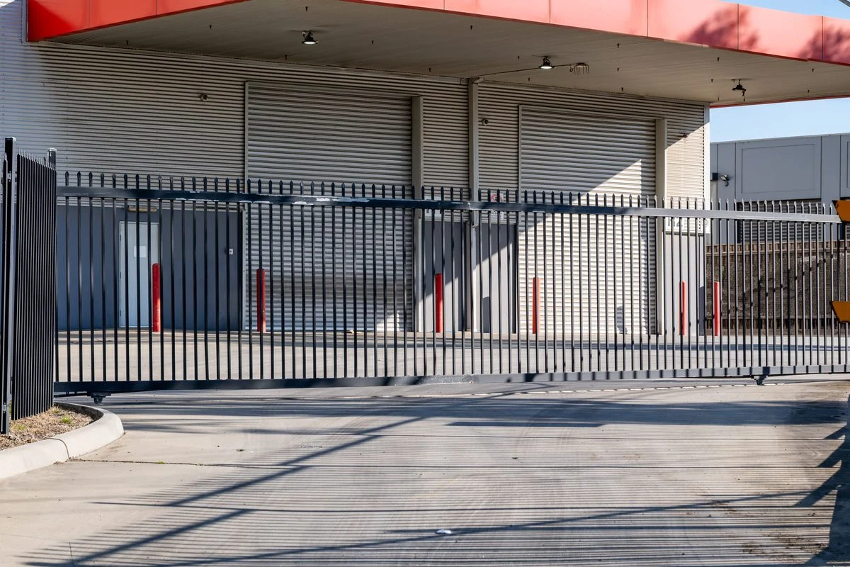 Steel slide gate across a commercial driveway